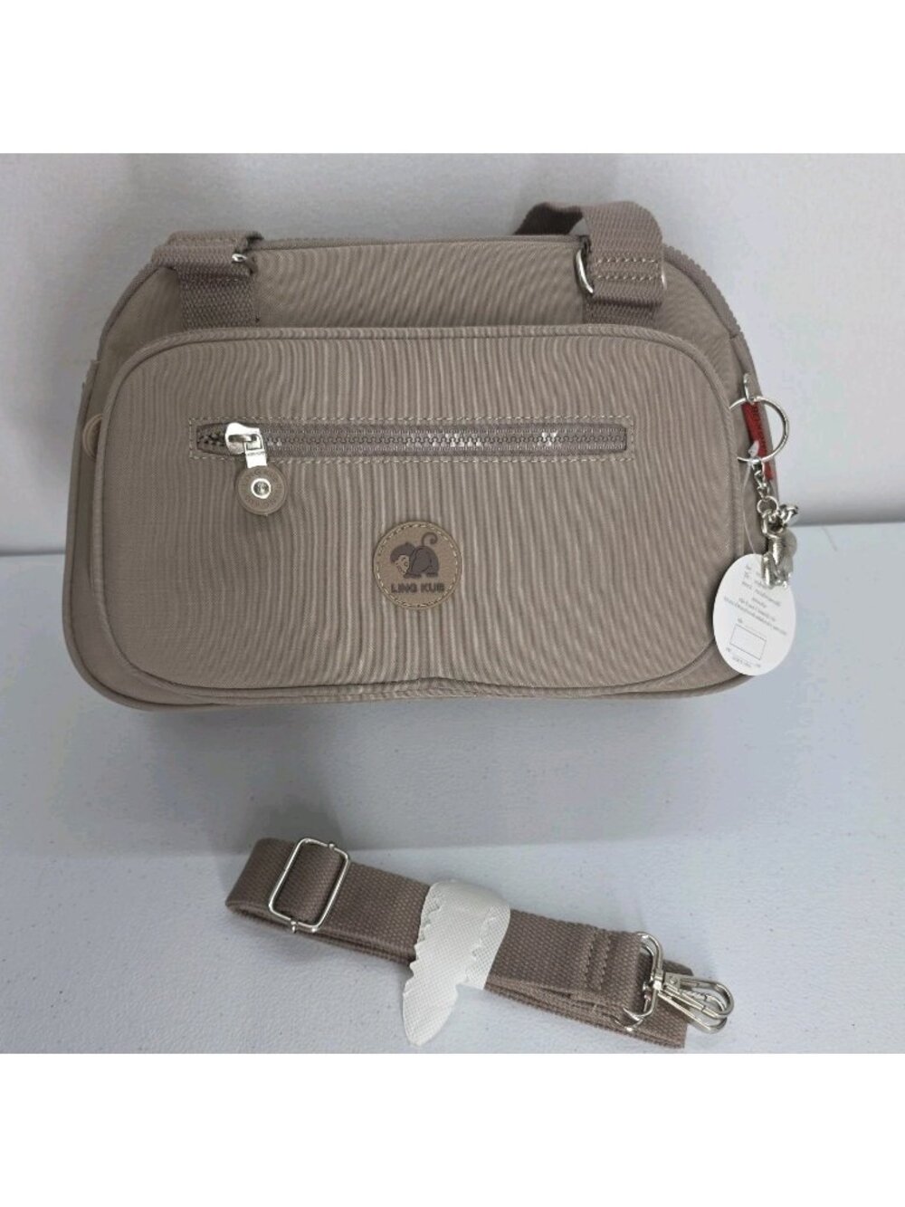 Ling Kub Crossbody Messenger Bag Tan Monkey Butt 6 Zipper Pockets NWT